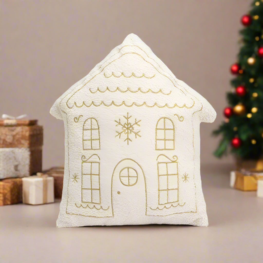 Beige and Gold Christmas Cushion. An embroidered house design in soft neutral tones.