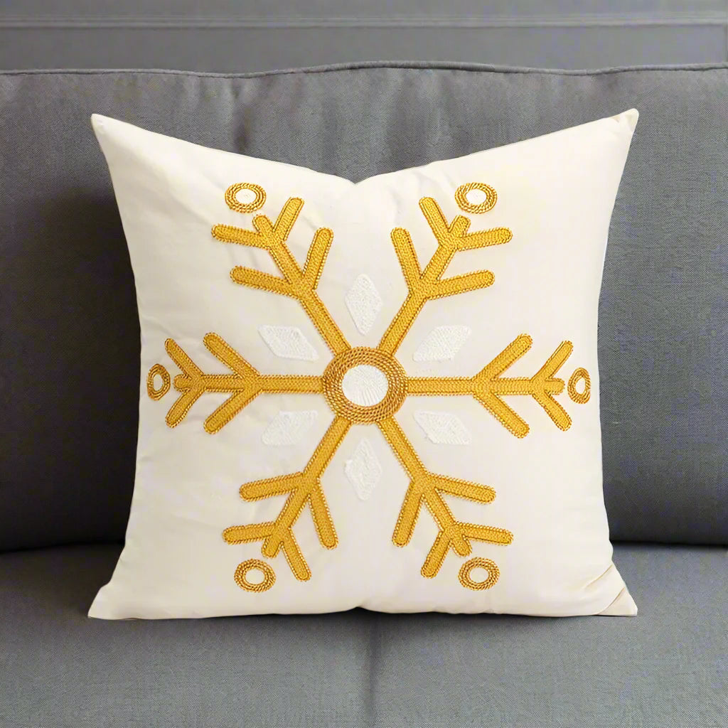 Beige and Gold Christmas Cushion. An embroidered snowflake design in soft neutral tones.