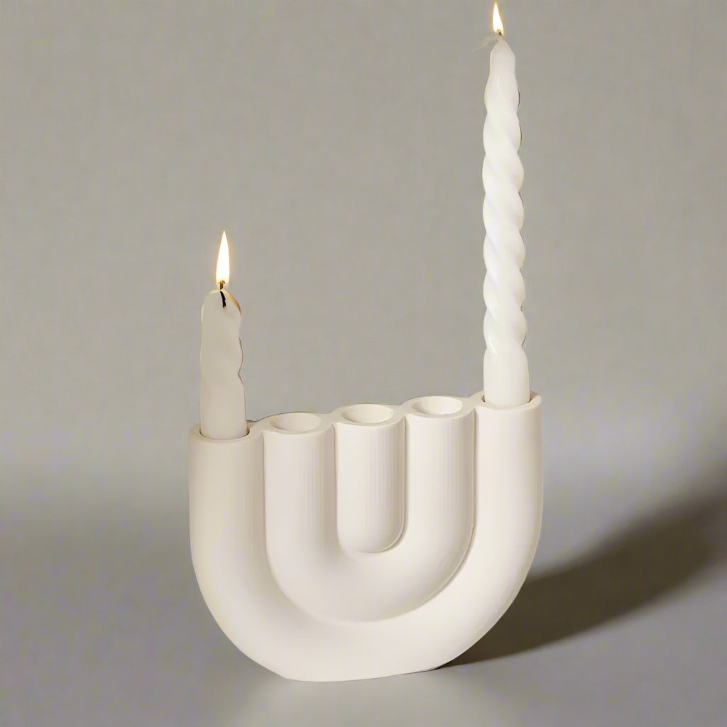 White U-shaped candle holder designed for four closely bunched candles