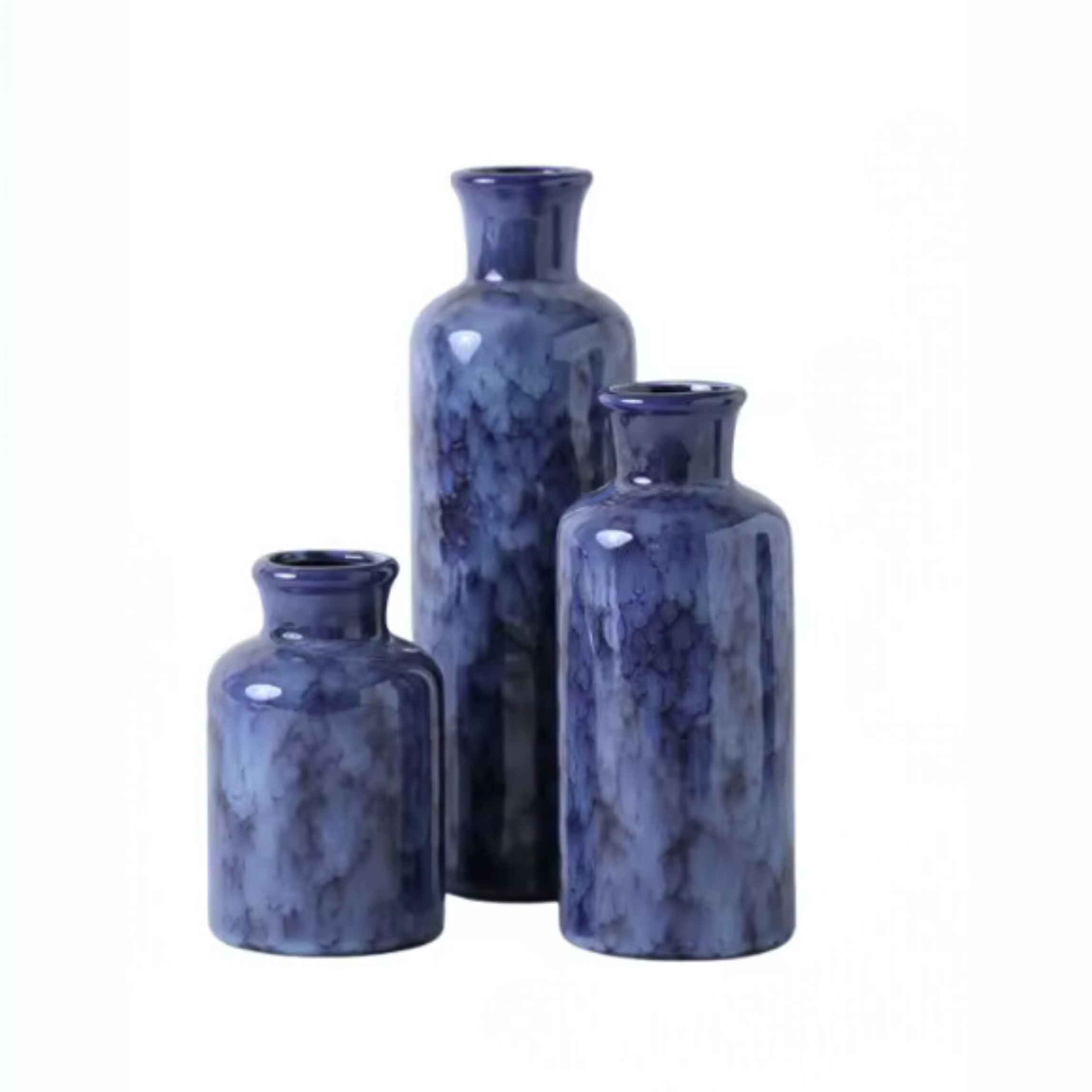 Set of three blue marble-textured vases on a white background