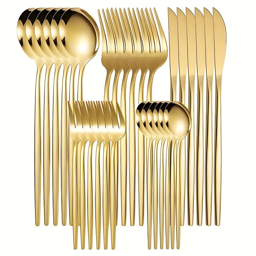 Set of gold cutlery including spoons, forks, and knives on a white background