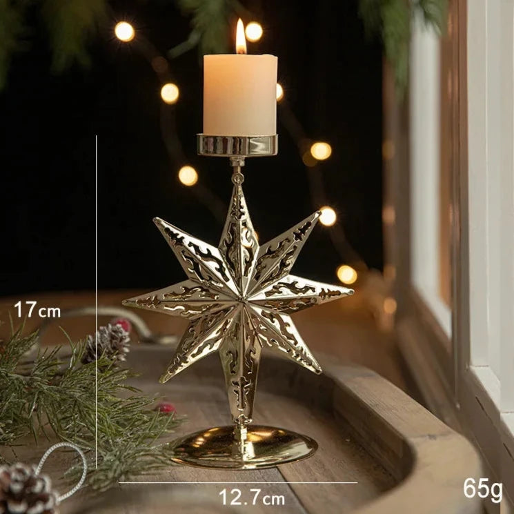 A gold metal candle holder with a festive 8-point star engraving