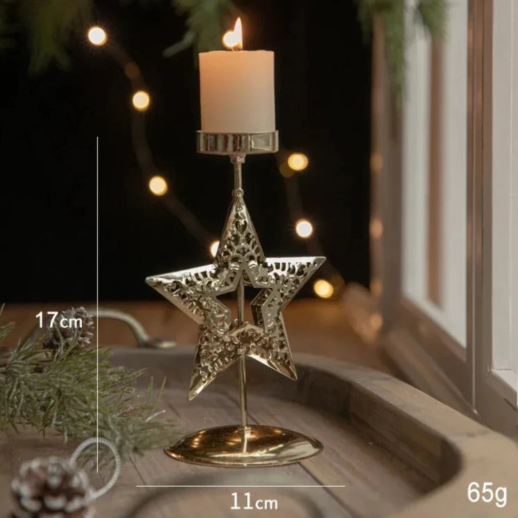 A gold metal candle holder with a festive star engraving