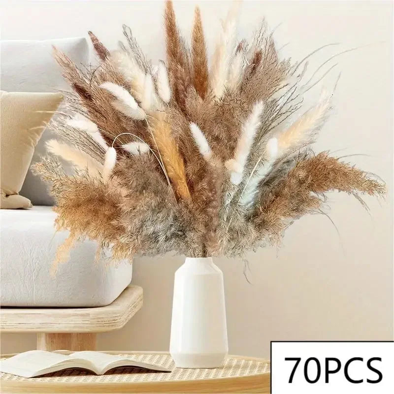 A decorative vase containing dried pampas blooms