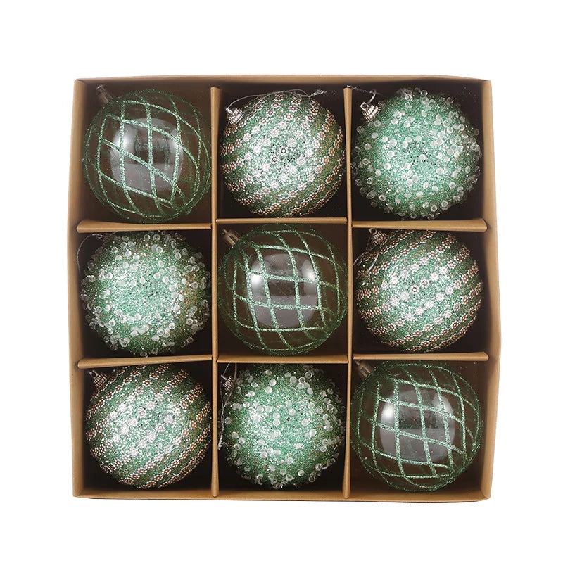 9-piece shiny bauble set in green. 8 cm plastic ornaments with 3 designs per box.