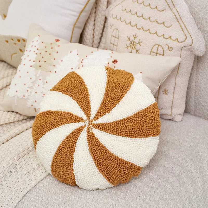 Beige and Gold Christmas Cushion. An embroidered pinwheel design in soft neutral tones.