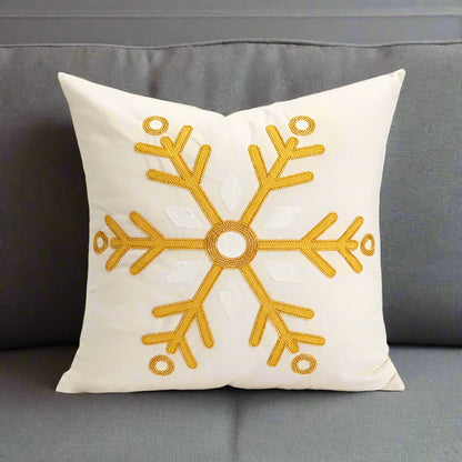 Beige and Gold Christmas Cushion. An embroidered snowflake design in soft neutral tones.
