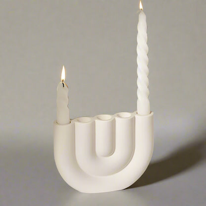 White U-shaped candle holder designed for four closely bunched candles