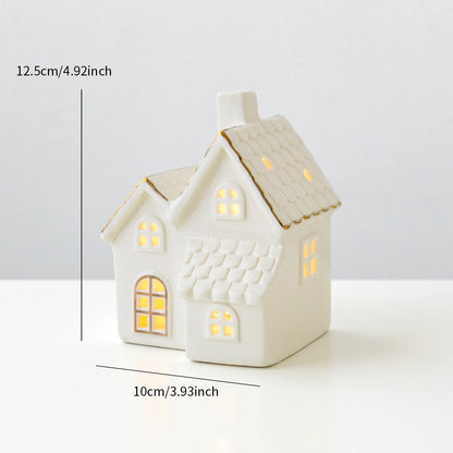 A ceramic Grand Vila Christmas house with lights, designed to create a mini Christmas village scene.