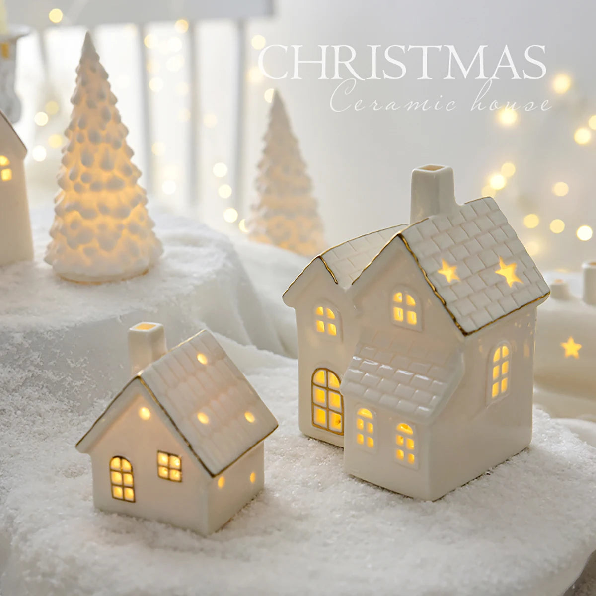 A set of ceramic Christmas houses with lights, designed to create a mini Christmas village scene, placed on a surface with snow and decorative lights.