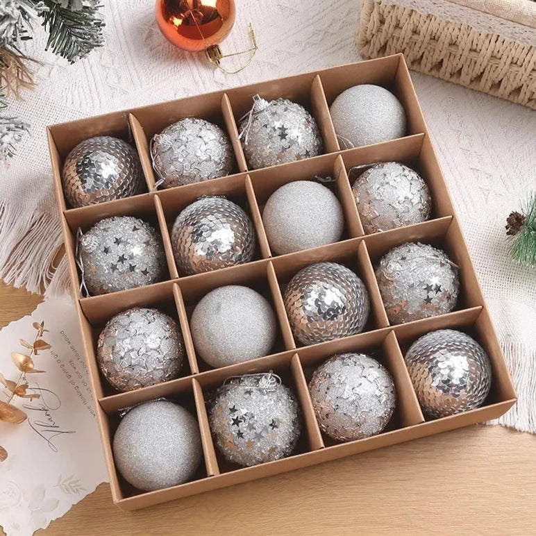A set of 16 silver sparkly, textured Christmas baubles, presented in open cardboard box.