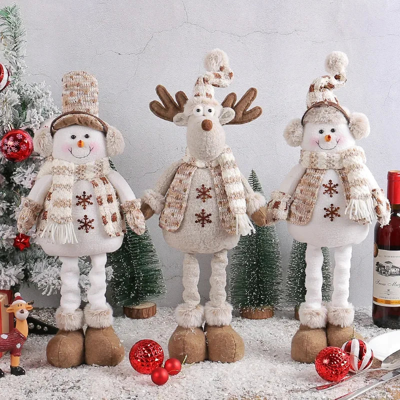 Festive, Christmas soft cloth figurines with telescopic legs featuring snowman and reindeer characters against a festive indoor background. 