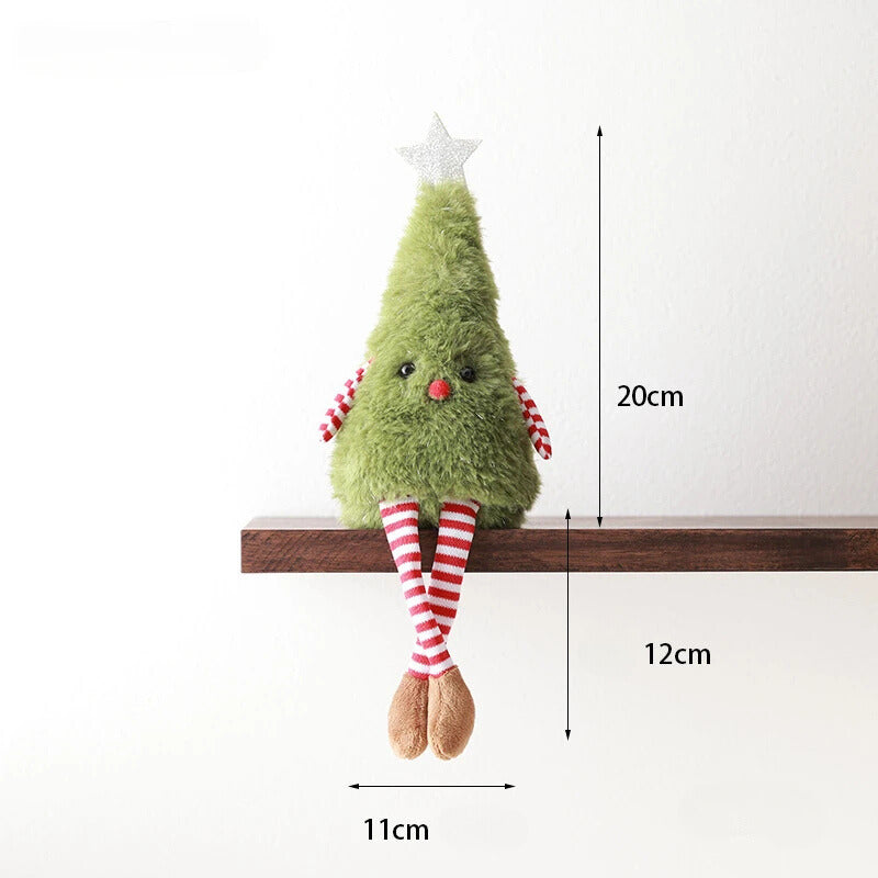 A cute plush Christmas tree, designed to sit on shelves with dangling striped legs. Made from soft synthetic bristle and plush fabric, it features a friendly face, red-and-white arms, and a silver star. Dimensions shown. 