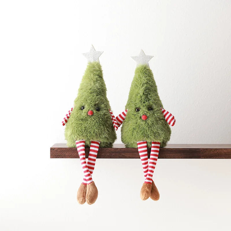 A pair of cute plush Christmas trees, designed to sit on shelves with dangling striped legs. They feature a friendly face, red-and-white arms, and a silver star.