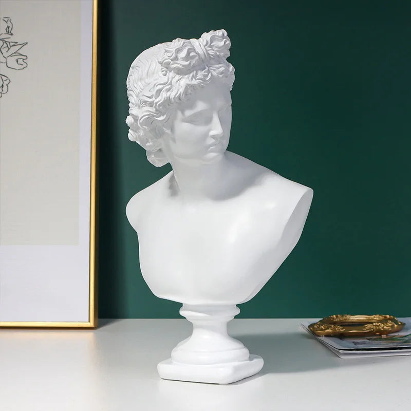 White classical Michelangelo David bust sculpture on a dark green background