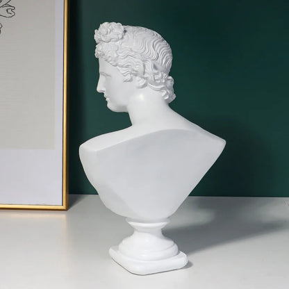 White classical Michelangelo David bust sculpture on a dark green background