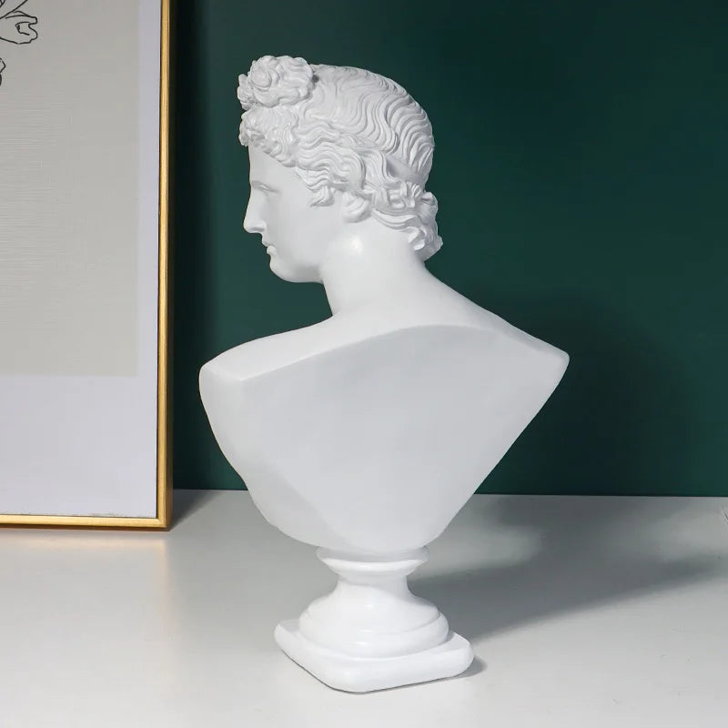 White classical Michelangelo David bust sculpture on a dark green background