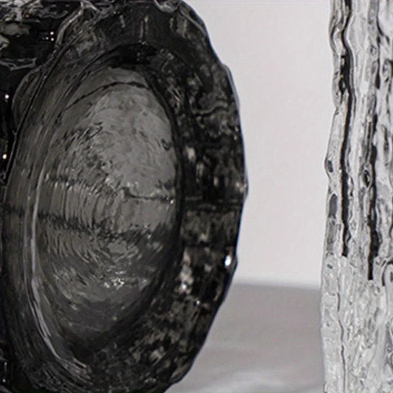 Close-up of a textured smoke grey glass vase base showing the ripple glass effect