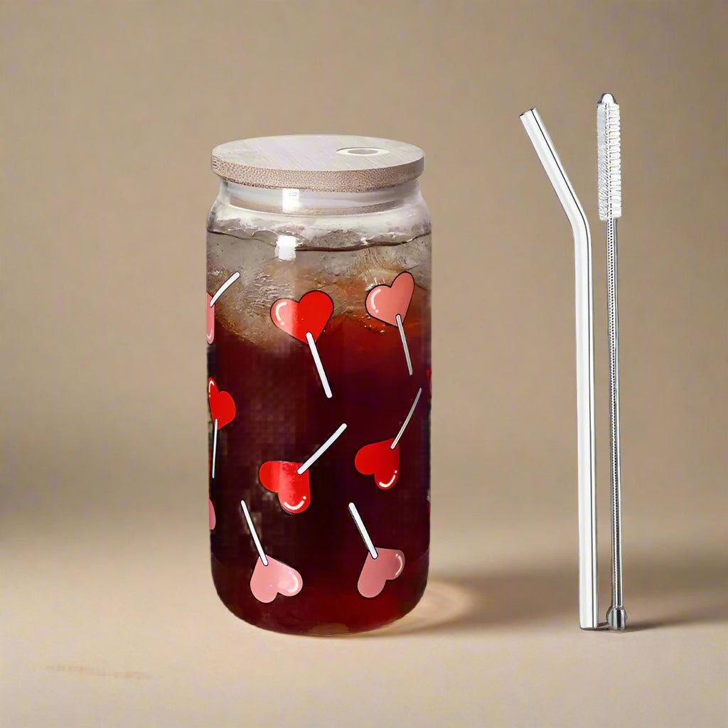 Glass drinking tumblers with heart lolly pop printed design and with bamboo lid and glass straw. 