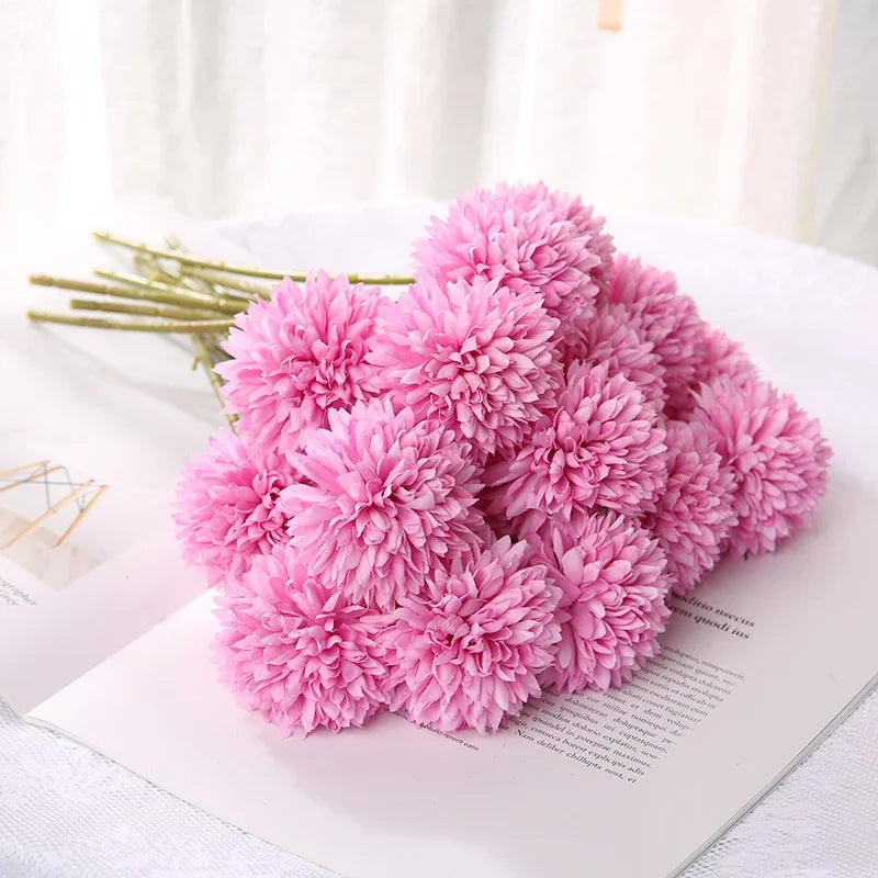 Artificial rose red hydrangea arrangement on a white surface