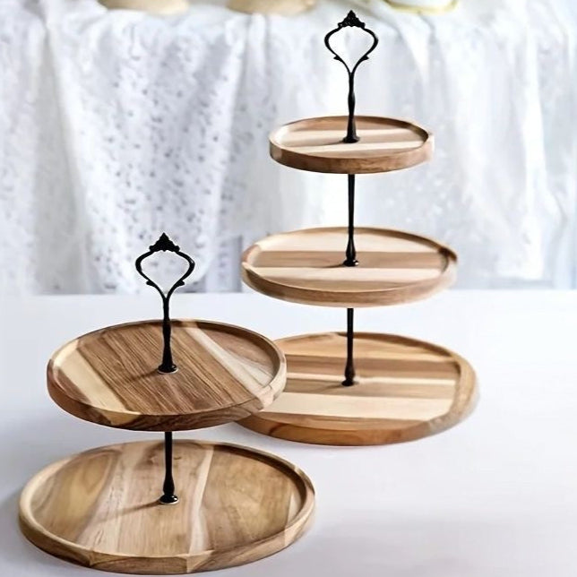 A two and three-tiered wooden, desert  serving tray with metal pole stands on a white background