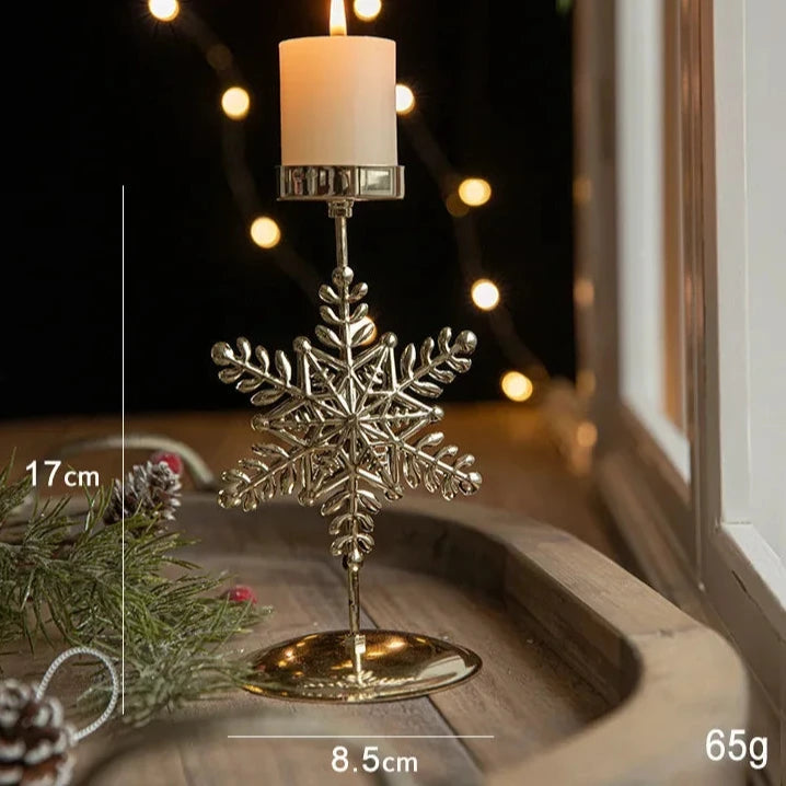 A gold metal candle holder with a festive snowflake engraving and measurements stated
