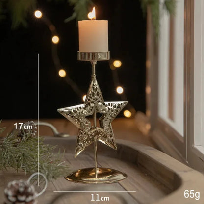 A gold metal candle holder with a festive star engraving
