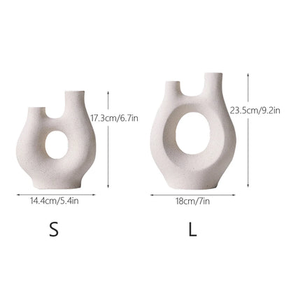 Two white ceramic vases with measurements labeled on a white background