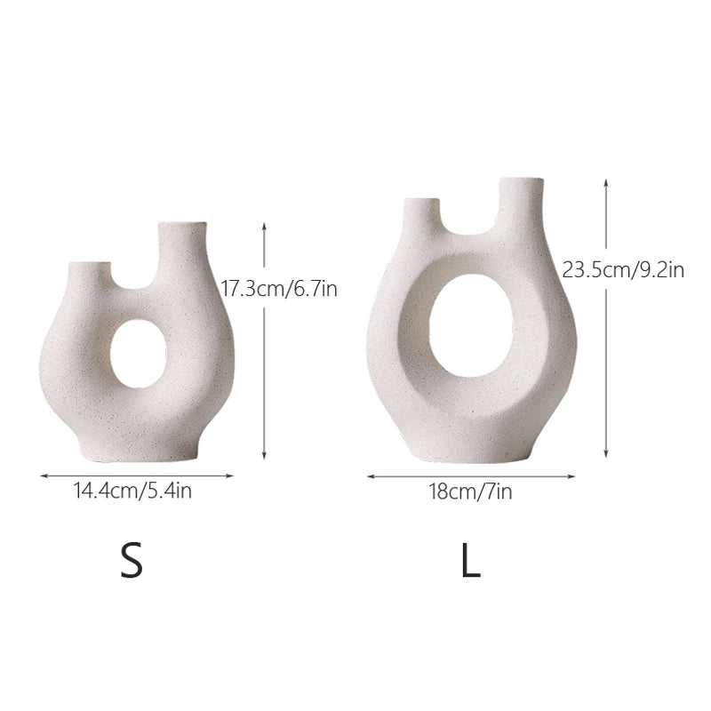 Two white ceramic vases with measurements labeled on a white background
