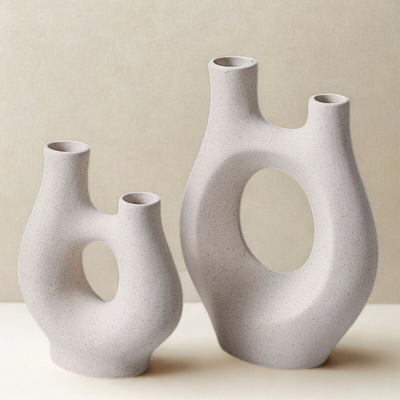 Two ceramic vases with Nordic abstract  designs on a neutral background
