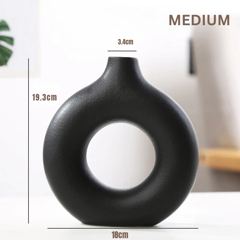 Black nordic vase with measurements on a white background
