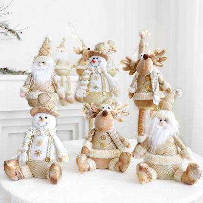 Festive, Christmas soft cloth figurines with telescopic legs featuring santa, snowman and reindeer characters against a white background. 