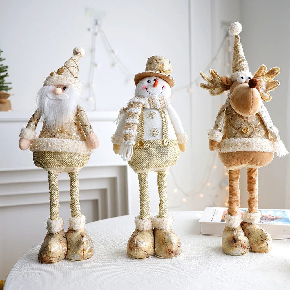 Festive, Christmas soft cloth figurines with telescopic legs featuring santa, snowman and reindeer characters against a white background. 