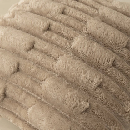 Close-up of a textured beige fabric cushion cover surface