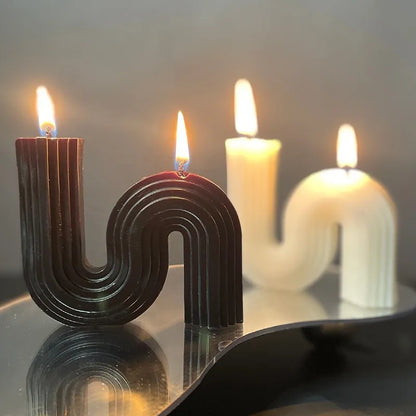 Two S-Shaped Soy Wax, Geometic candles in white and dark brown. 