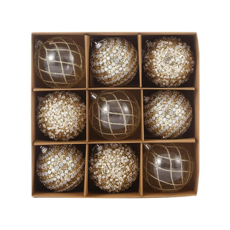 9-piece shiny bauble set in gold. 8 cm plastic ornaments with 3 designs per box. 