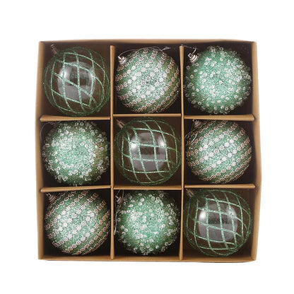9-piece shiny bauble set in green. 8 cm plastic ornaments with 3 designs per box. 