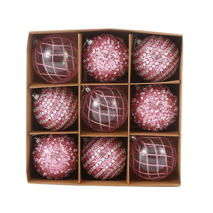 9-piece shiny bauble set in pink. 8 cm plastic ornaments with 3 designs per box. 