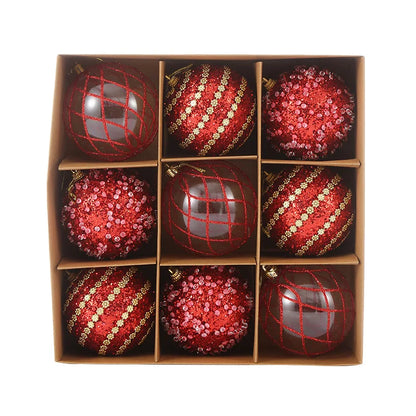 9-piece shiny bauble set in red. 8 cm plastic ornaments with 3 designs per box. 