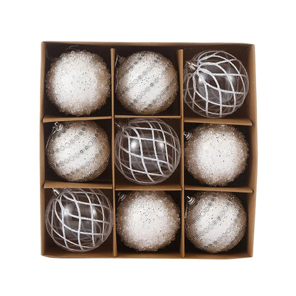 9-piece shiny bauble set in white. 8 cm plastic ornaments with 3 designs per box. 