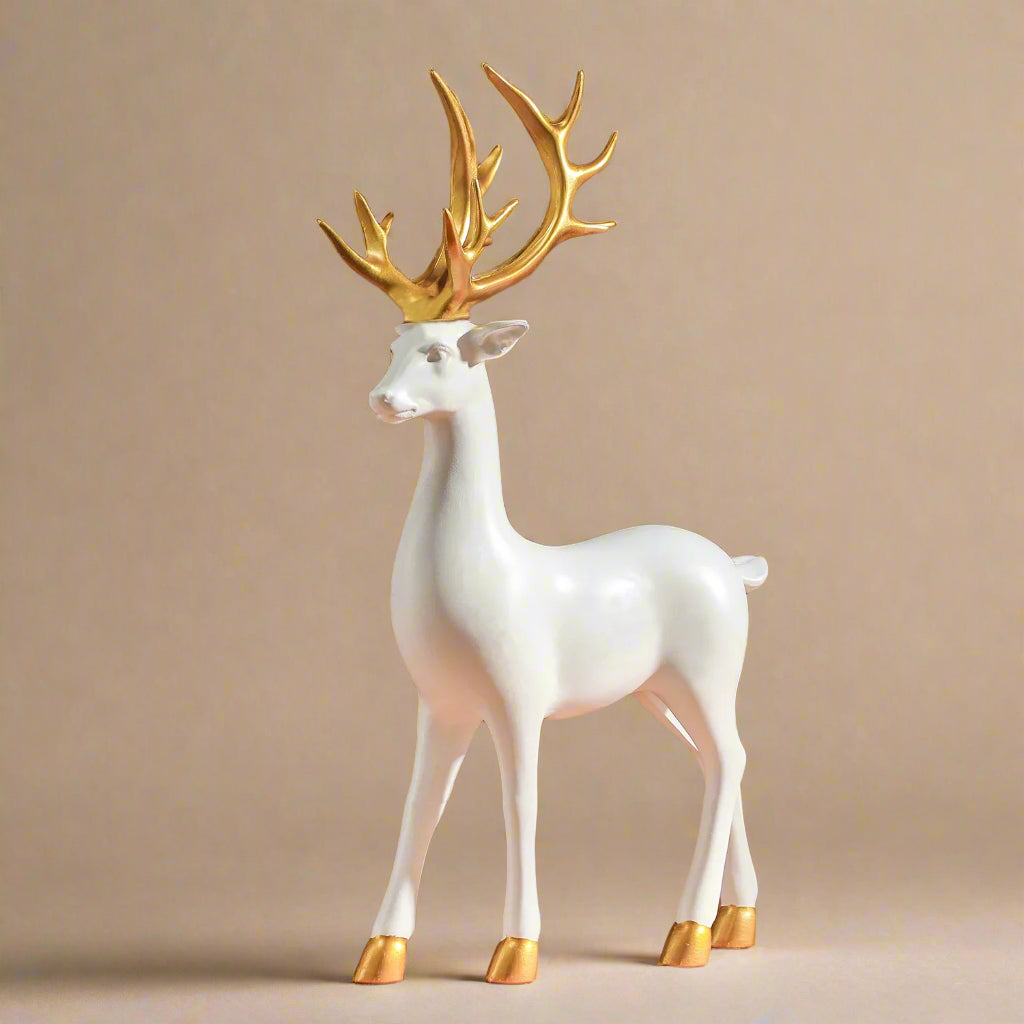 White deer figurine with gold antlers and hooves on a brown background