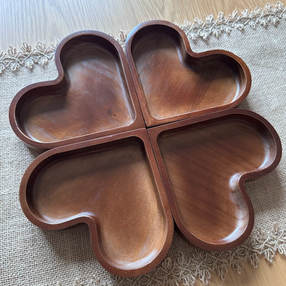 Wooden four-leaf clover shaped tray on a lace tablecloth